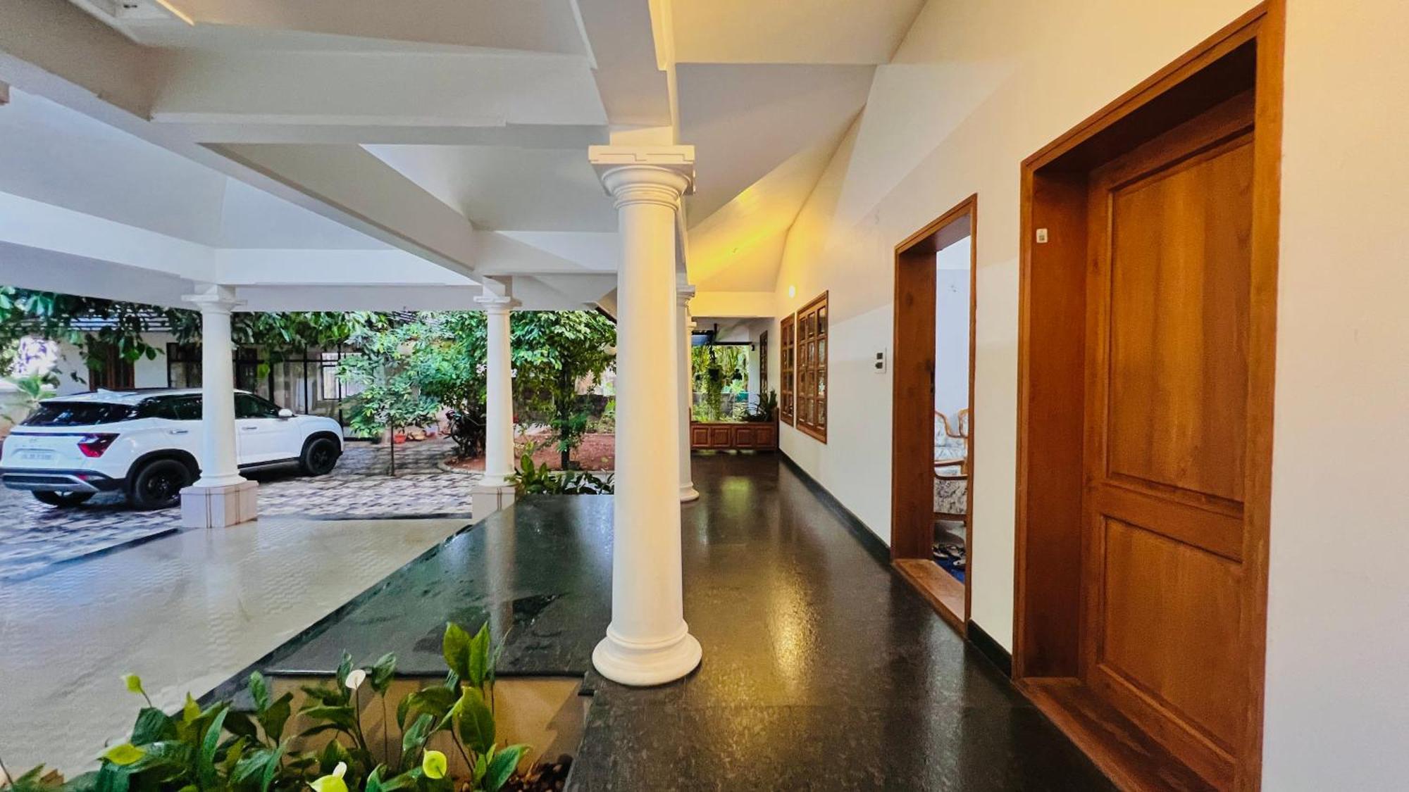 Waterfront By Palmyra Apartment Kollam Bagian luar foto